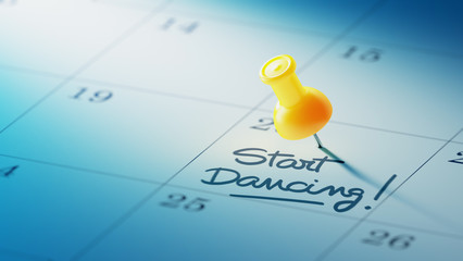 Concept image of a Calendar with a yellow push pin. Closeup shot