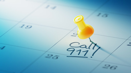 Concept image of a Calendar with a yellow push pin. Closeup shot