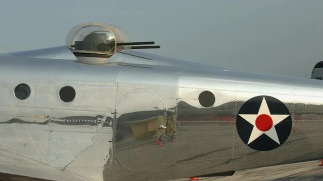 Military version of the Beechcraft AT-11 Kansan, the C-45 Expeditor used by USAAF during World War II.  Details with passerby reflected in metal finish.  Recorded in 4K, ultra high definition.
