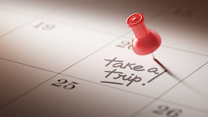 Concept image of a Calendar with a red push pin. Closeup shot of