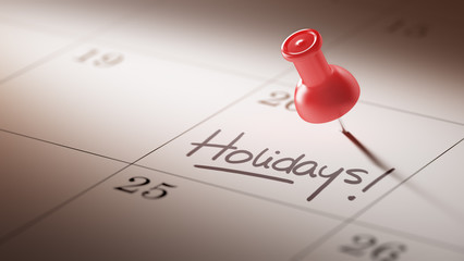Concept image of a Calendar with a red push pin. Closeup shot of