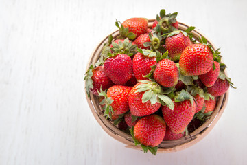 fresh strawberries in rattan basket