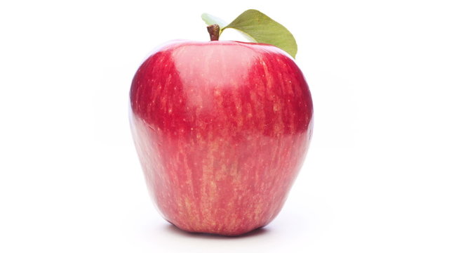 Rotating red apple  isolated on white  