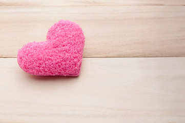Pink heart on wood , holiday valentines background