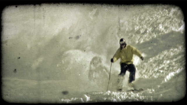 Expert skier skis down moutain. Vintage stylized video clip.
