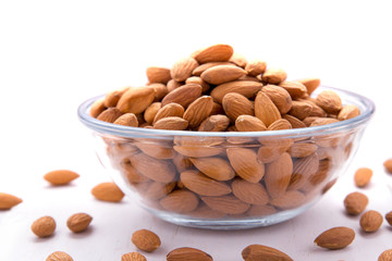Fototapeta na wymiar a bowl full of almonds