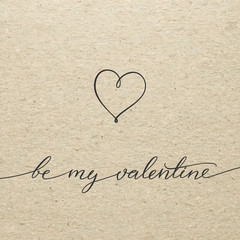 Be my Valentine for Valentines day. Calligraphy lettering on cardboard.