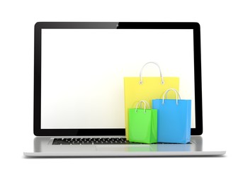 laptop and  shopping pags on white background