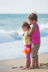 Naklejka premium Happy kids are running on the beach 