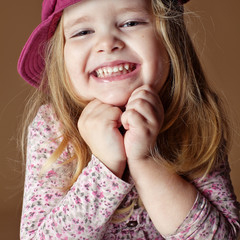 Happy smiling  little girl in a cap  © nuzza11