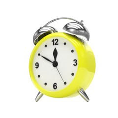 Yellow alarm clock on white