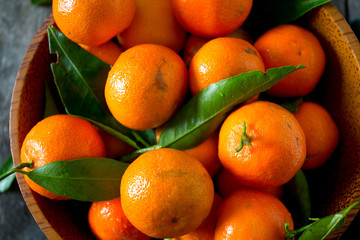 mandarines in a wooden bowl
