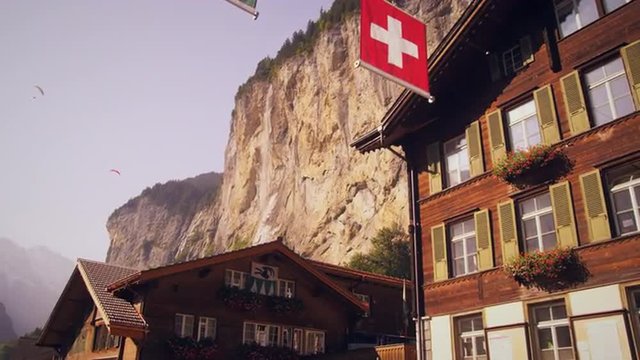 Panning shot of paragliders from Lauterbrunnen, Switzerland