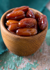 dried dates on a beautiful wooden background