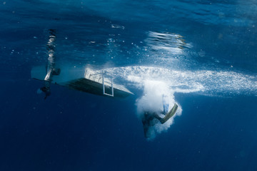 scuba diver jumping from boat