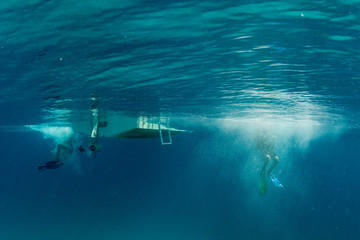 scuba diver jumping from boat