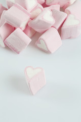 Fototapeta na wymiar heart-shaped marshmallows isolated on white