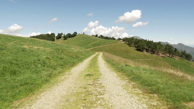 Walking along road in mountain nature scenery  establishing gimbal steadicam  