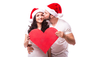 Romantic Young Happy Couple hugging and big red heart isolated on white background