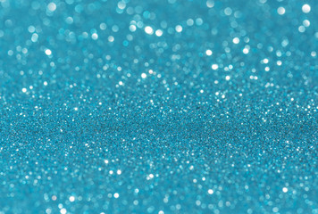 Blue glitter bokeh abstract light background