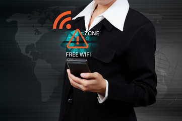 Businessman holding a smartphone connecting to WiFi