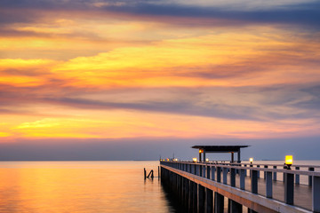 Obraz premium Summer, Travel, Vacation and Holiday concept - Wooden pier between sunset in Phuket, Thailand