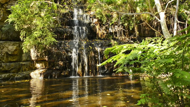 The 4th of 5 waterfalls in the Moremi Gorge, Botswana, Africa in high definition footage with ambient audio