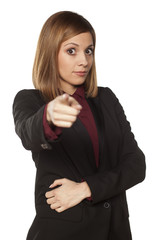 Obraz premium serious business woman pointing a finger at you