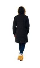 Back view of going  woman in parka. © ghoststone