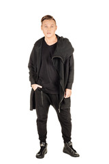 Naklejka premium Full length portrait of a happy male fashion man against wall i