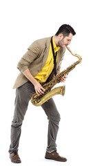 Naklejka premium man saxophonist playing saxophone player in studio isolated on w