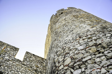 Castle wall against light blue sky