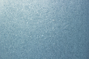 Obraz premium Frozen window background. Ice on the glass. Blue