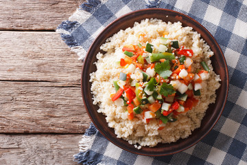 Vegetarian Couscous with vegetables close-up Horizontal top view
