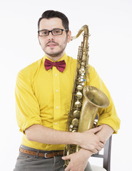 saxophone player in yellow shirt with bowtie, isolated on white
