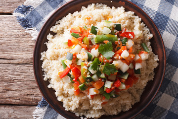 Asian Couscous with vegetables close-up. Horizontal top view

