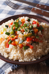 Arabic cuisine: couscous with vegetables close-up. Vertical
