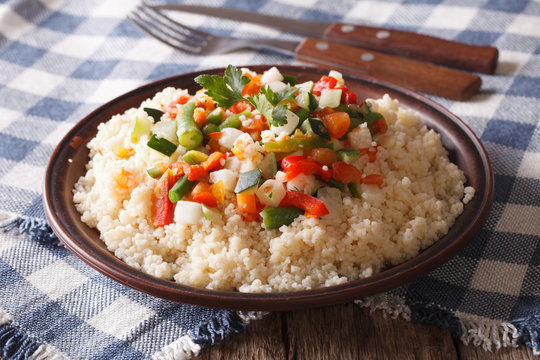 Asian Couscous with vegetables close-up. horizontal
