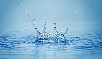 Water splash on blue background