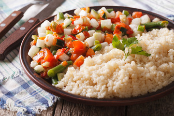 Vegan couscous with vegetable on a plate closeup. horizontal
