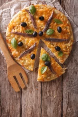 Papier peint photo Pizzeria Sliced pizza with anchovies and onions. vertical top view    © FomaA