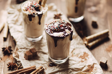Milk shake with whipped cream and liquid chocolate