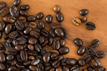 Coffee bean against wooden background