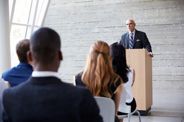 Fototapeta premium Senior Businessman Addressing Delegates At Conference