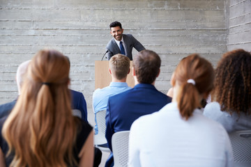 Businessman Addressing Delegates At Conference