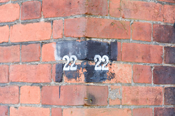 House Number 22 faded sign