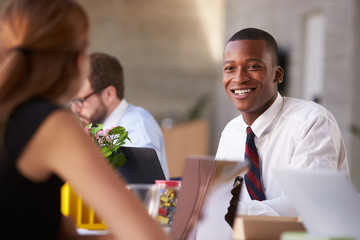 African American Businessman At Meeting With Colleagues