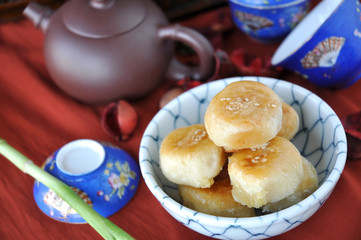 Chinese Pastry with Tea Pot on Background