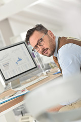 Middle-aged businessman with eyeglasses in office