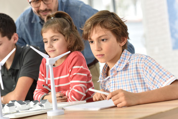 Elementary school pupils learning about renewable energy